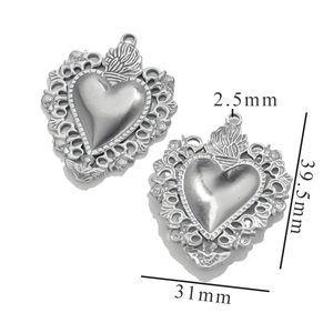 Detailed size view of silver stainless steel heart pendants with vintage floral patterns