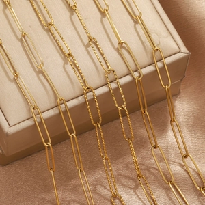 Detail of PVD gold plated stainless steel paperclip chain and diamond-cut textured links