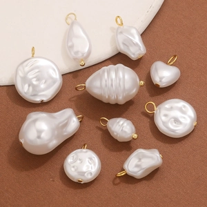 Assorted white faux pearl pendants with gold metal loops for DIY jewelry making