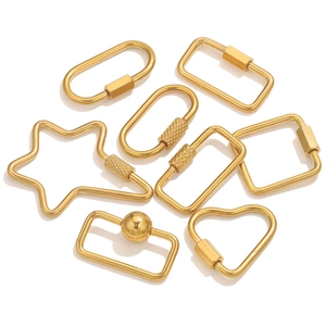 Detailed macro view of gold plated screw lock clasps in heart and star shapes
