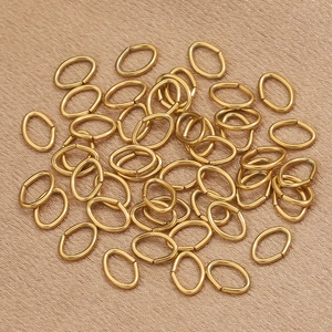 Macro shot of gold-plated stainless steel oval jump rings for DIY jewelry making