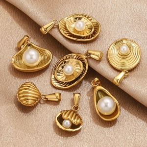 Detailed set of seven gold stainless steel pearl charms in shell and spiral designs