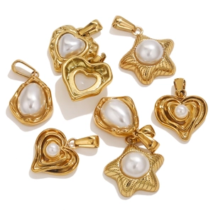 Detail of star and heart shaped gold metal pendants with pearls for DIY jewelry making