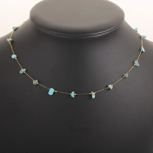Detailed close-up of 18k gold plated chain featuring natural turquoise stone fragments