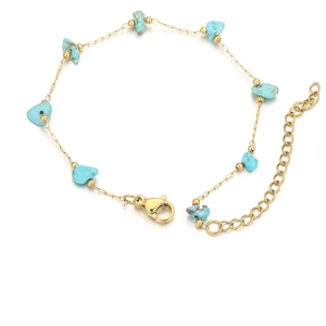 Detail of 18k gold plated chain with turquoise stones and adjustable lobster clasp