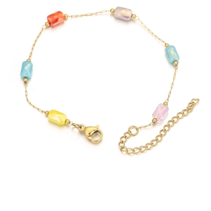 Detailed macro view of gold chain bracelet with five colorful rectangular gemstone beads