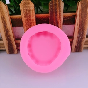 Pink round silicone mold with wavy edges for DIY chocolate or fondant cake decoration