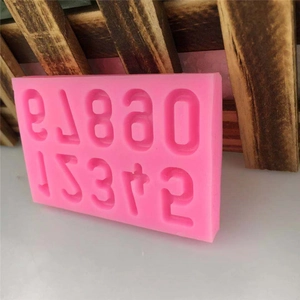 Pink silicone number mold for DIY cake fondant and chocolate making from a 45-degree angle