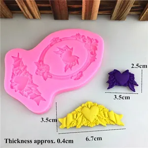 Stampo in silicone con ali a cuore rosa per decorazioni di torte fondente e resina