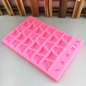Pink silicone mold featuring 26 alphabet letters with flower and leaf decorative shapes