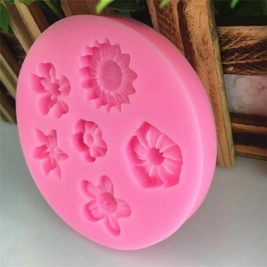 Moule en silicone rose avec six motifs floraux dont tournesol pour gâteaux DIY et fondant