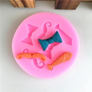 Pink silicone mold for DIY fondant featuring mustache, bowtie, and necktie shapes