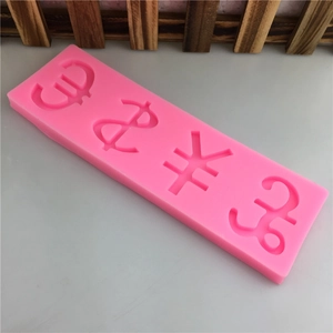 Pink silicone mold featuring dollar, euro, pound, and yuan signs for fondant and DIY cakes