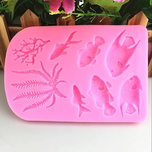 Pink silicone mold with coral and sea fish shapes for DIY cake decorating and baking