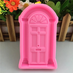 Pink silicone mold featuring a detailed European arched door design for fondant and crafts
