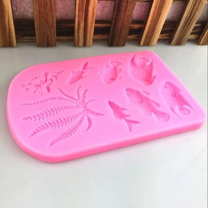 Pink silicone mold with sea fish, coral, and seaweed patterns for DIY cake baking and crafts