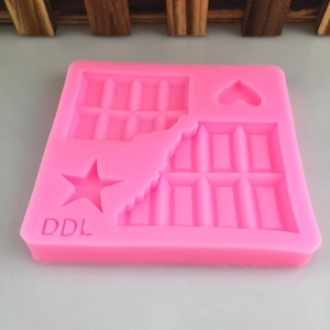 Pink silicone mold featuring rectangular chocolate bars, star and heart shapes for DIY crafts