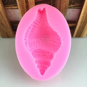 Pink silicone mold featuring detailed seashell and conch textures for fondant or DIY resin crafts
