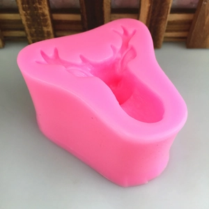 Pink silicone deer head mold for DIY cake decorating, resin craft, or scented soap making