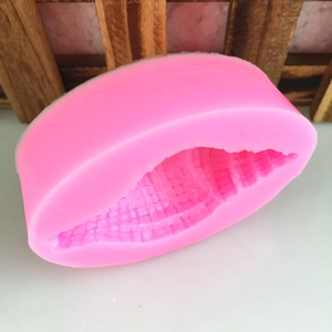 Pink silicone mold featuring intricate ocean shell texture for DIY chocolate and crafts