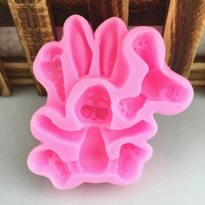 Pink silicone DIY mold featuring cute cartoon bunny and carrot shapes for cake baking