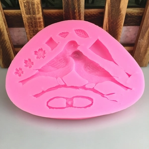 Pink silicone bird on branch fondant mold for cake decorating and chocolate crafting
