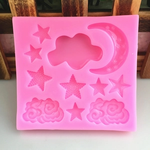 Pink silicone mold featuring star moon and cloud shapes for DIY cake fondant and baking