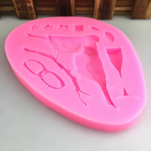 Pink silicone mold featuring hummingbird and flower designs for fondant and DIY crafts