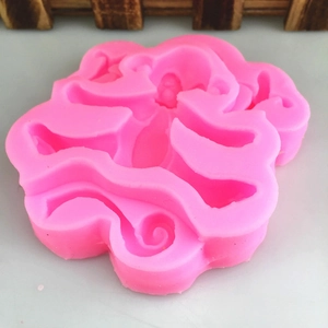 Pink silicone monkey and flower shaped cake mold for fondant and chocolate baking