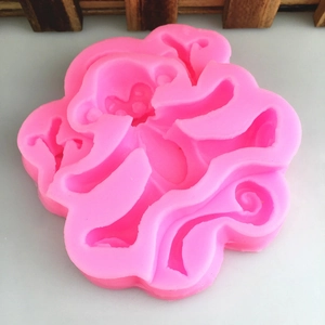 Pink monkey-shaped silicone mold for cake decoration, fondant, and chocolate DIY