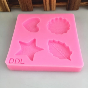Moule en silicone rose avec formes de cœur, étoile, marguerite et feuille pour le bricolage