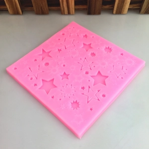 Pink square silicone mold with various star and sun shapes for DIY crafts and fondant