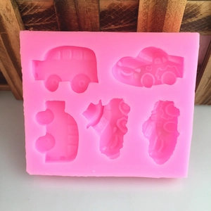 Pink silicone mold with 5 car shapes for DIY baking and chocolate cake decoration