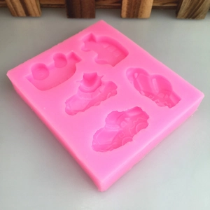 Pink silicone DIY mold featuring 5 different car and construction vehicle shapes