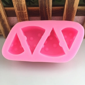 Close-up of pink 4-cavity triangle silicone mold for DIY cheese or dessert making