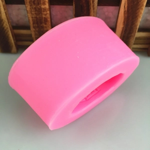 Pink silicone mold for DIY soap and resin crafts with oval gold ingot coin shape design