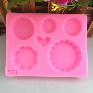 Pink silicone waffle and macaron dessert mold with heart and flower shapes for DIY baking