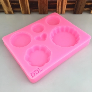 Pink silicone waffle and macaron mold with multi-cavity heart and flower shapes for DIY baking