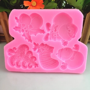 Pink silicone Christmas mold with Santa, snowman, and stocking shapes for DIY cake decor