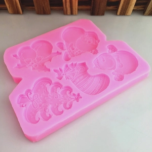 Pink silicone mold with Christmas tree and Santa shapes for fondant and cake decorating