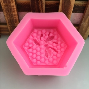 Pink 3D hexagonal silicone mold with honeycomb and bee pattern for DIY soap and cake