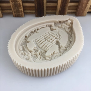 Detailed ivory silicone birdcage mold with vintage crown and floral relief patterns