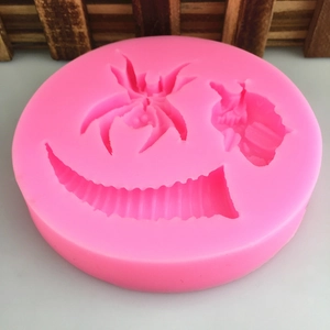 Detailed pink silicone mold for Halloween baking with spider and horn shaped cavities
