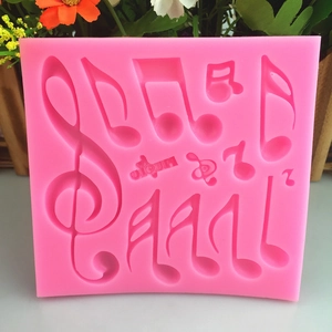 Moule en silicone rose pour notes de musique avec clé de sol et lettres de musique