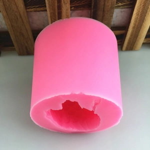 Pink 3D owl-shaped silicone mold for DIY candles, soap, and plaster crafts on desk