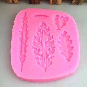 Pink silicone mold for fondant and chocolate featuring five distinct fern leaf textures