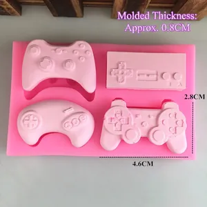 Pink silicone game controller mold with four classic console gamepad styles for DIY baking