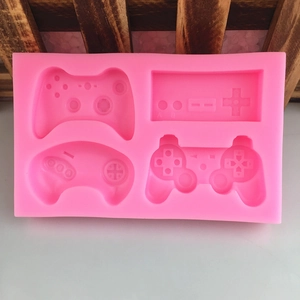 Pink silicone game controller mold with four unique designs for fondant and chocolate