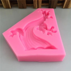 Pink silicone mold featuring traditional Chinese wave and cloud patterns for DIY cake decor