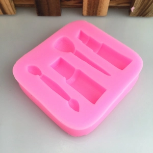 Pink silicone makeup theme mold with lipstick, nail polish and brush shapes for DIY baking
